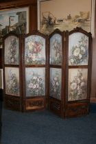 Antique carved walnut four-fold dressing screen, the arch top with carved floral surmounts, each