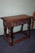 Antique joint stool, the rectangular top with moulded edge above carved C scroll frieze, raised on