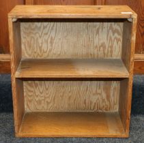 Manner of Heals of London, a limed oak bookcase, 45cm wide, 50cm tall, 20cm deep.