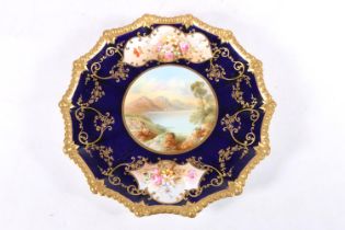Aynsley porcelain cabinet plate, the central vignette depicting a lake scene with two further floral
