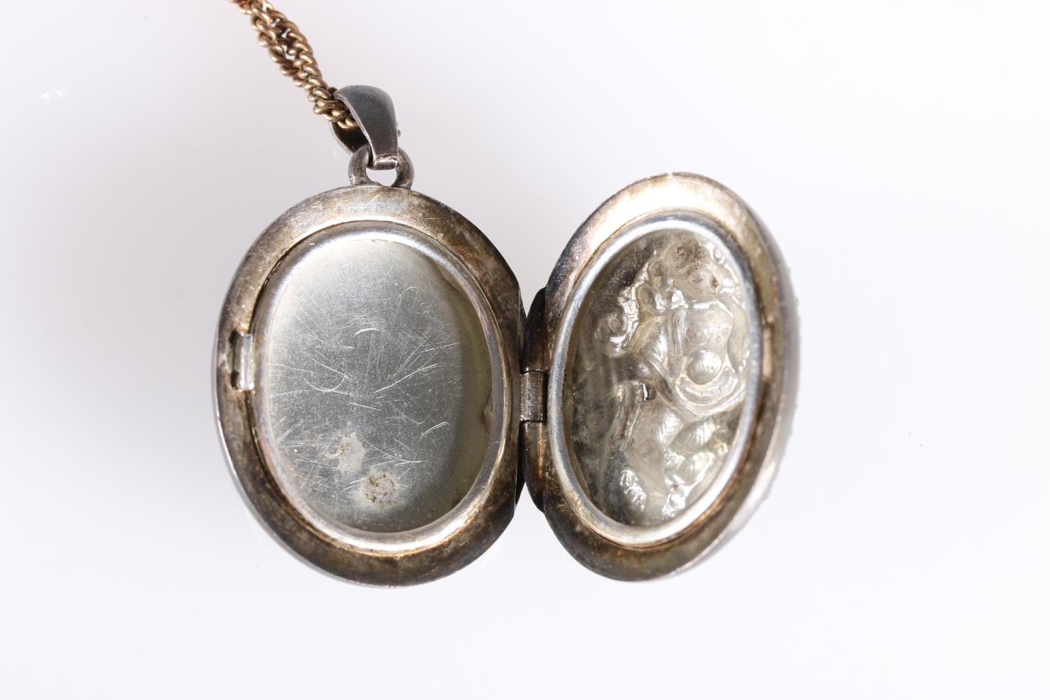 Late 19th early 20th century white metal locket with deity entwined by serpent to front, 3.5cm. - Image 3 of 3