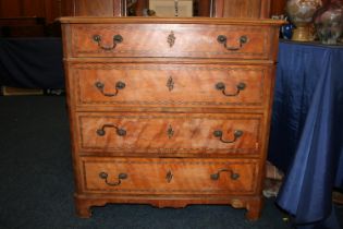 Satinwood and chequered banded chest of drawers, the rectangular top with canted corners  and