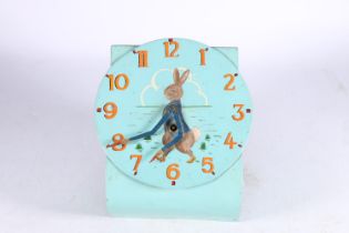 20th century wall clock painted with Peter Rabbit design, the clock hands modelled as Peter Rabbit's