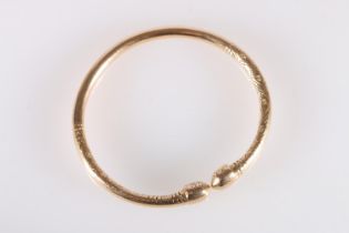 18ct gold West Indian torque shaped bayras bangle with incised decoration, stamped '18ct', 48.5g.