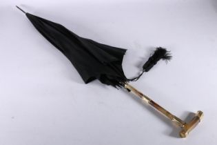 Antique parasol or umbrella, the horn handle possibly Rhino horn with 18ct gold plated mounts, one