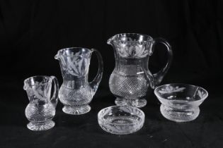 Graduated set of three Edinburgh Crystal thistle pattern jugs of thistle shape with hobnail cut