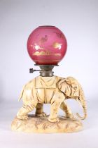 Continental porcelain oil lamp in the form of an elephant, in the manner of Alfred Stellmacher, blue