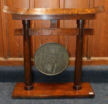 Chinese gong, the oak frame of temple form supporting a circular bronze gong with character mark and