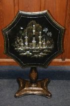 Victorian Jappaned black lacquered tilt top table, the scalloped octagonal top decorated with