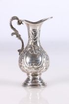 Arabic 900 grade silver jug with embossed jug with double scroll handle, the base with three marks