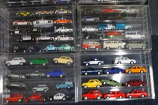 Large collection of diecast emergency and other vehicles held in perspex cases, makers including