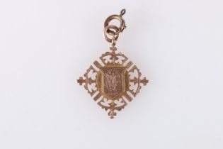 Victorian 9ct gold medal fob with shield shaped central cartouche framed by pierces borders,