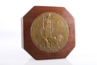 WWI bronze death plaque [DAID LISTER] set into a mahogany block.