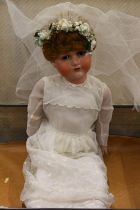 Bergmann of Waltershausen large bisque head sleepy eye doll in wedding dress and wearing wreath, the