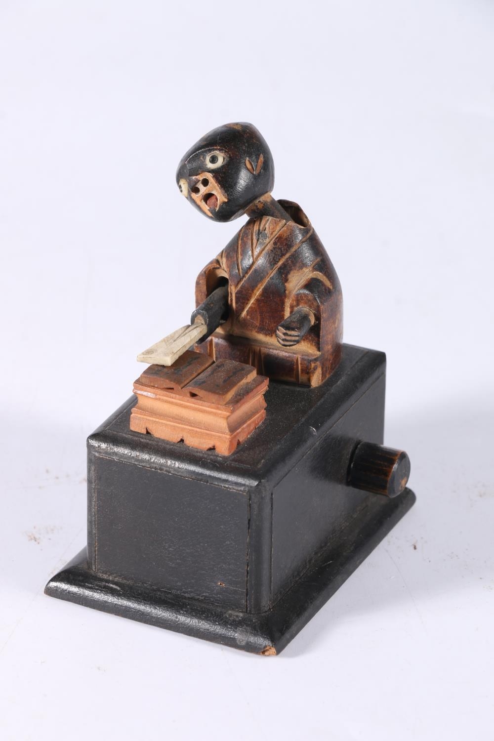 Japanese Kobe Toy treen automaton modelled as a headmaster shaking head and slamming paddle down