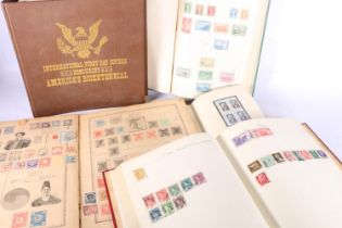 Stamp collection held across five albums including an album of USA International First Day Covers