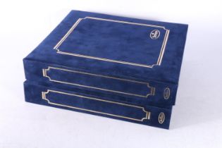 Two Benham blue cloth covered albums containing the Great British Gold Medal Winner London