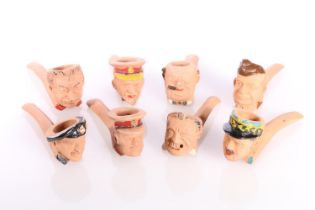 Eight terracotta smoking pipes by Delf modelled as busts of Allied leaders including Churchill,