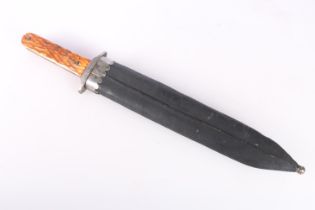 Bowie hunting knife with carved bone or horn hilt, the blade with scalloped spine, blade length