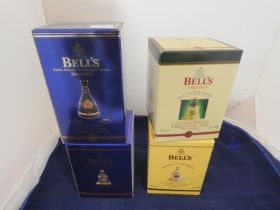 Three Bell's old scotch whisky Christmas limited edition decanters with contents, Dated 1998,