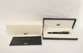 Montblanc. ''Starwalker'', a black resin rollerball pen, with 'floating star' cap, together with