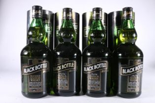Four bottles of Black Bottle blended Scotch whisky, one in the 130th Anniversary Edition tube,