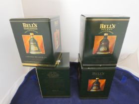 Four Bell's finest old scotch whisky Christmas decanters with contents, Dated 1992, 1994, 1995,