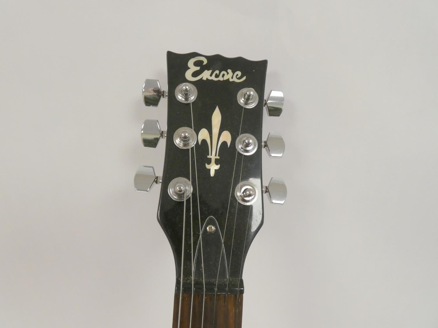 Encore six string electric guitar in maroon colour, 100cm in length. - Image 3 of 7