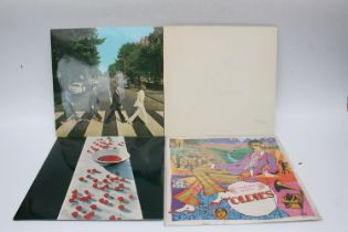 Four Beatles and Beatles related records to include The White Album with black inner sleeves