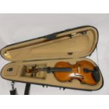 3/4 length students violin in fitted case and bow.