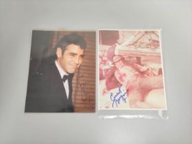 Celebrity Autographs. Signed photograph of George Clooney and another of Ernest Borgnine. (2)