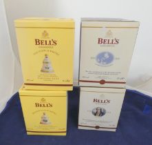 Two Bell's old scotch whisky Christmas limited edition decanters with contents, Dated 2003, 2005,