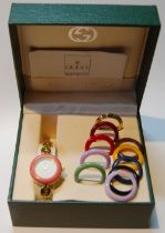 Gucci gold plated lady's bangle wristwatch with ten interchangeable coloured ring bezels, ref no.