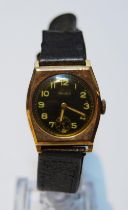Majex gent's 9ct gold watch of tonneau shape, 1945, on strap.