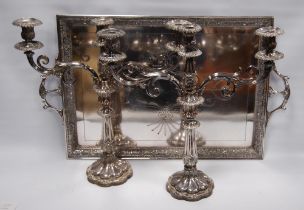 Pair of antique silver plated candelabra, each with twin scroll branches, sconce to the top and