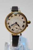 9ct gold backed wristwatch, c. 1920s, with white enamel dial, Roman numerals and seconds dial,