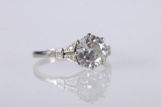 18ct gold and platinum diamond engagement ring with central 1.5ct diamond and diamond-set shoulders,