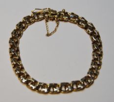 Gold bracelet of filed double curb pattern, '18kt', 23.7g.