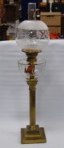 Young's brass oil lamp, c. late 19th/early 20th century, with later glass funnel and shade, original