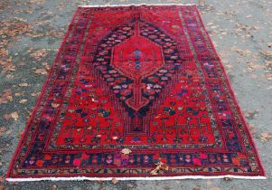 Persian nomadic tribal Lori hand-knotted rug with large gul lozenge to the centre, encircled by