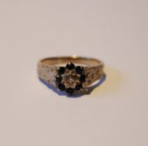 18ct gold lady's gemstone ring in a cluster setting, size O, 4.7g gross.