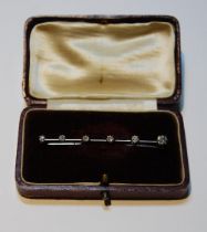 Diamond bar brooch with six brilliants, in white gold.