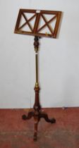 Victorian-style mahogany and brass music stand on turned column and tripod supports