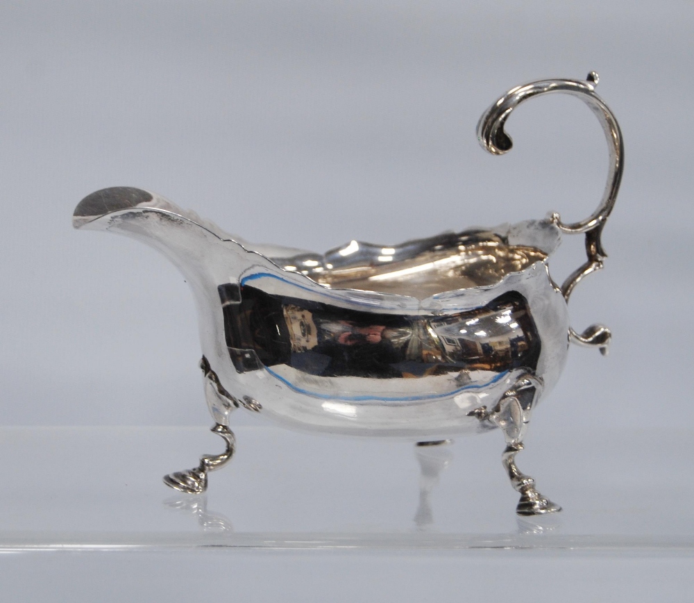 Silver sauce boat with cut edge, on pad feet, probably John Mewburn, 1757, 172g.