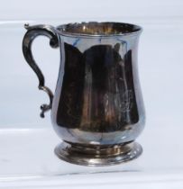 Silver pint mug of baluster shape with scroll handle, by John Kidder, 1784, 26cm, 314g.