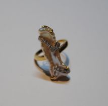 18ct gold ring with baroque pearl overlaid with two bands of tiny diamonds, size N, 5.4g gross.
