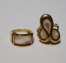 Two 9ct gold rings set with mother of pearl, size N, 11g gross.