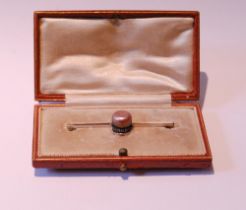 Unusual bar brooch modelled as a jockey cap from a pink pearl, the peak with tiny diamond