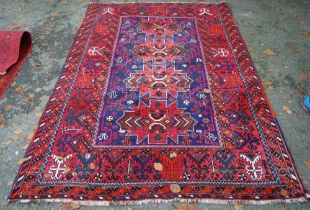 Persian Bakhtiari hand-knotted rug with four large geometric lozenges to the centre and further