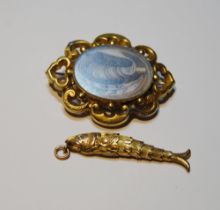 Victorian gold flexible fish pendant, probably 9ct, and a mourning brooch, probably 15ct.